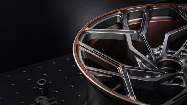 Precision-machined custom forged wheel on an engineering fixture